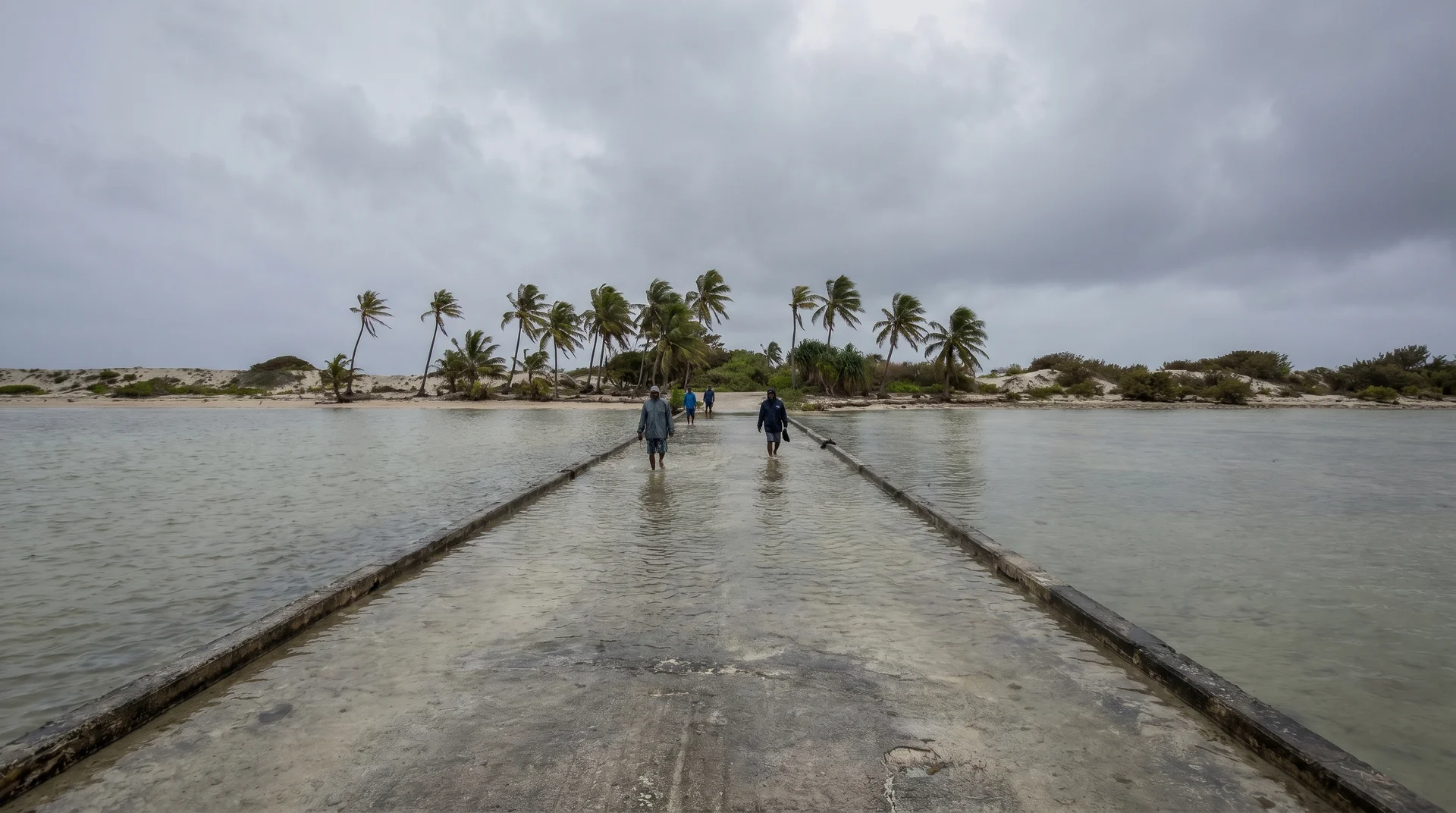 Seawater flooding a low-lying road in Funafuti, Tuvalu during king tide season in February