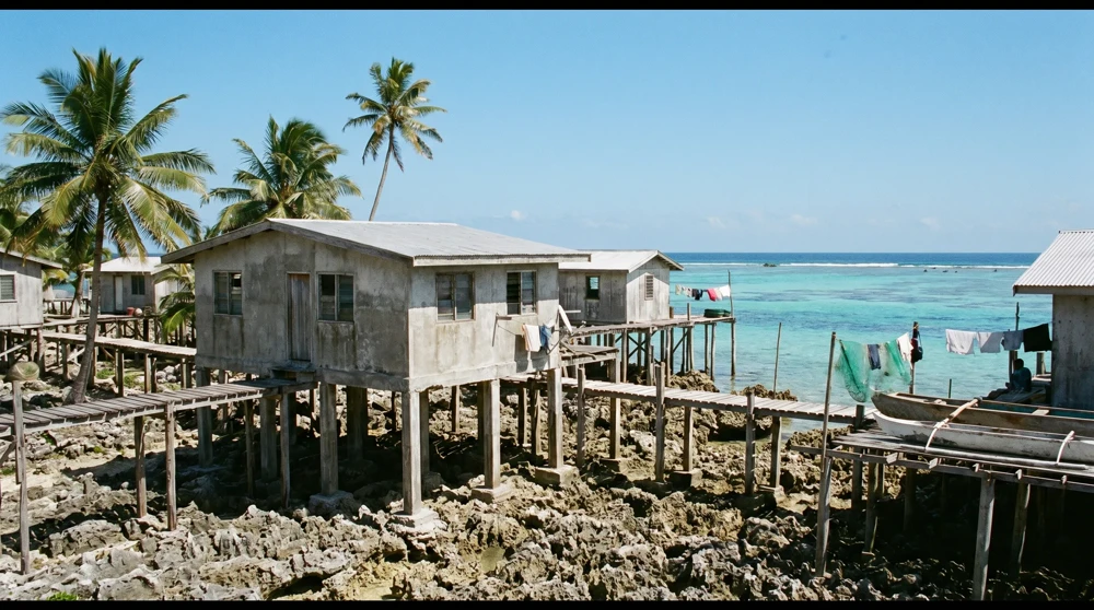 Traditional raised houses on tall pillars in Nukulaelae, Tuvalu, designed to combat rising sea levels