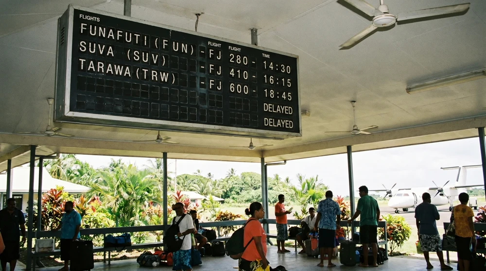 Flight departure board at a Pacific regional airport showing the limited connections available to Funafuti, Tuvalu